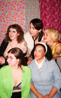 a group of women posing for a picture