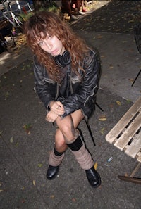 a woman sitting on a bench